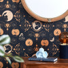 Navy and gold fertility wallpaper with cupid candle, lamp and book