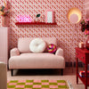 Roomset of vintage geometric wallpaper in vintage pink and poison apple red colourway 